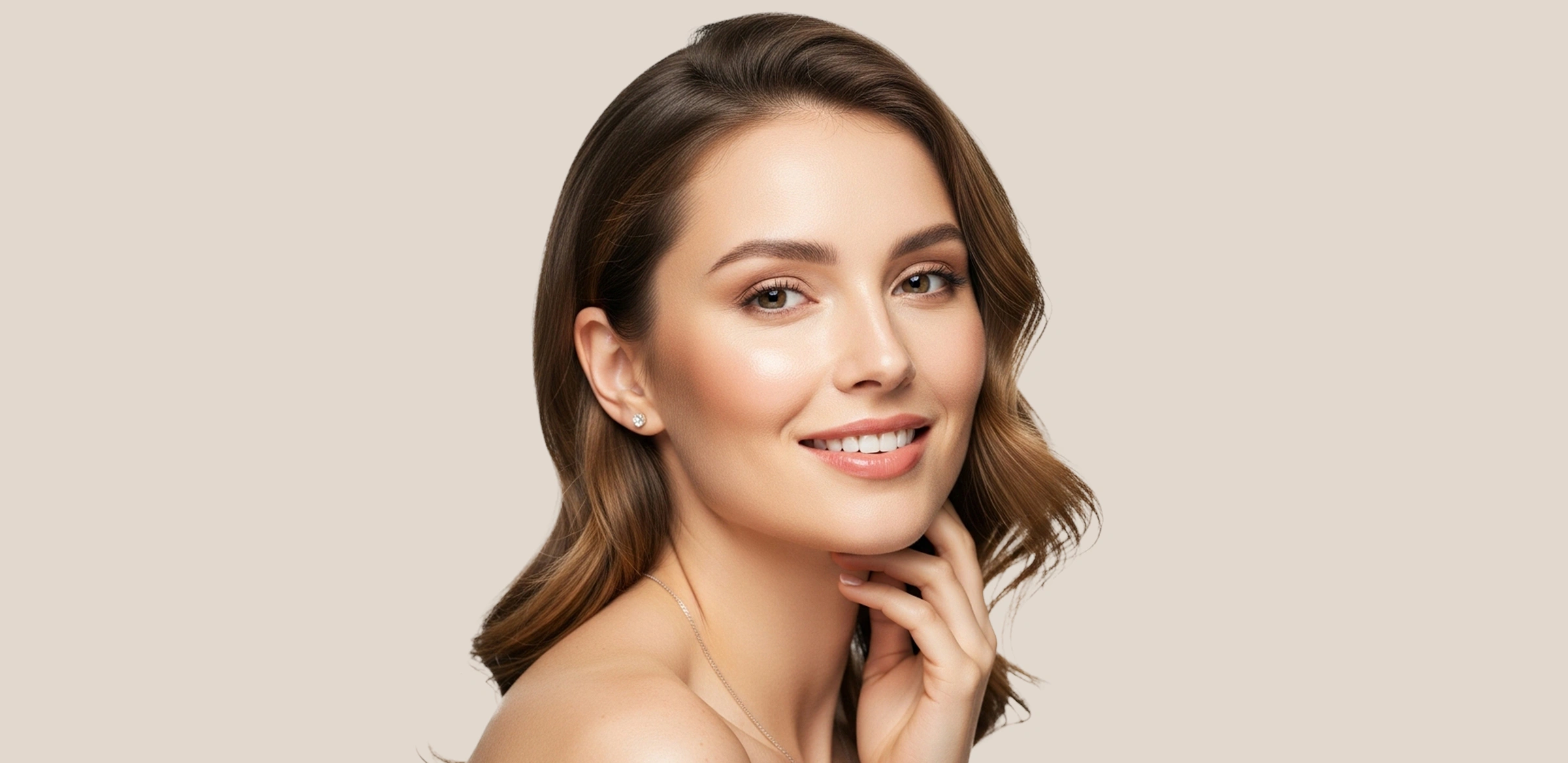 Smiling woman with radiant, lifted skin touching her neck